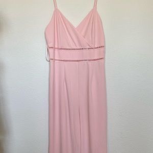 Baby pink jumpsuit with peak-a-boo stitching above waist. NWT